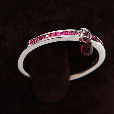 Gold Half Diamond Eternity Thumb Ring with a Pink Tourmaline
18ct gold with 0.25ct of diamond