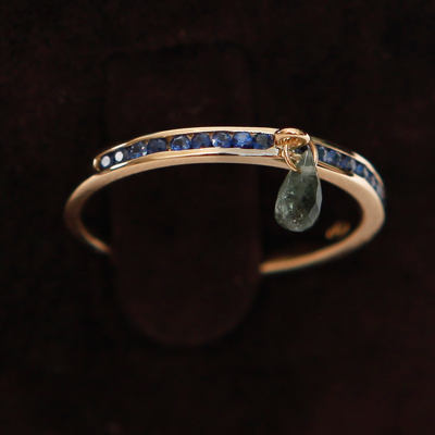 Gold Half Sapphire Eternity Thumb Ring with a green Tourmaline
18ct gold with 0.23ct of Blue Sapphire