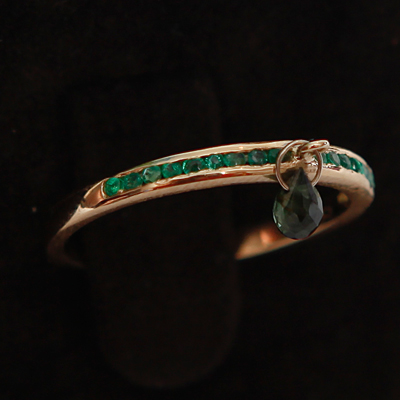 Gold Half Emerald Eternity Thumb Ring with a Green Tourmaline
18ct gold with 0.23ct of Green Emerald